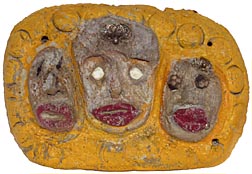 Outsider art concrete faces